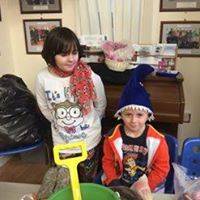 Emily and Henry posing for a photograph.